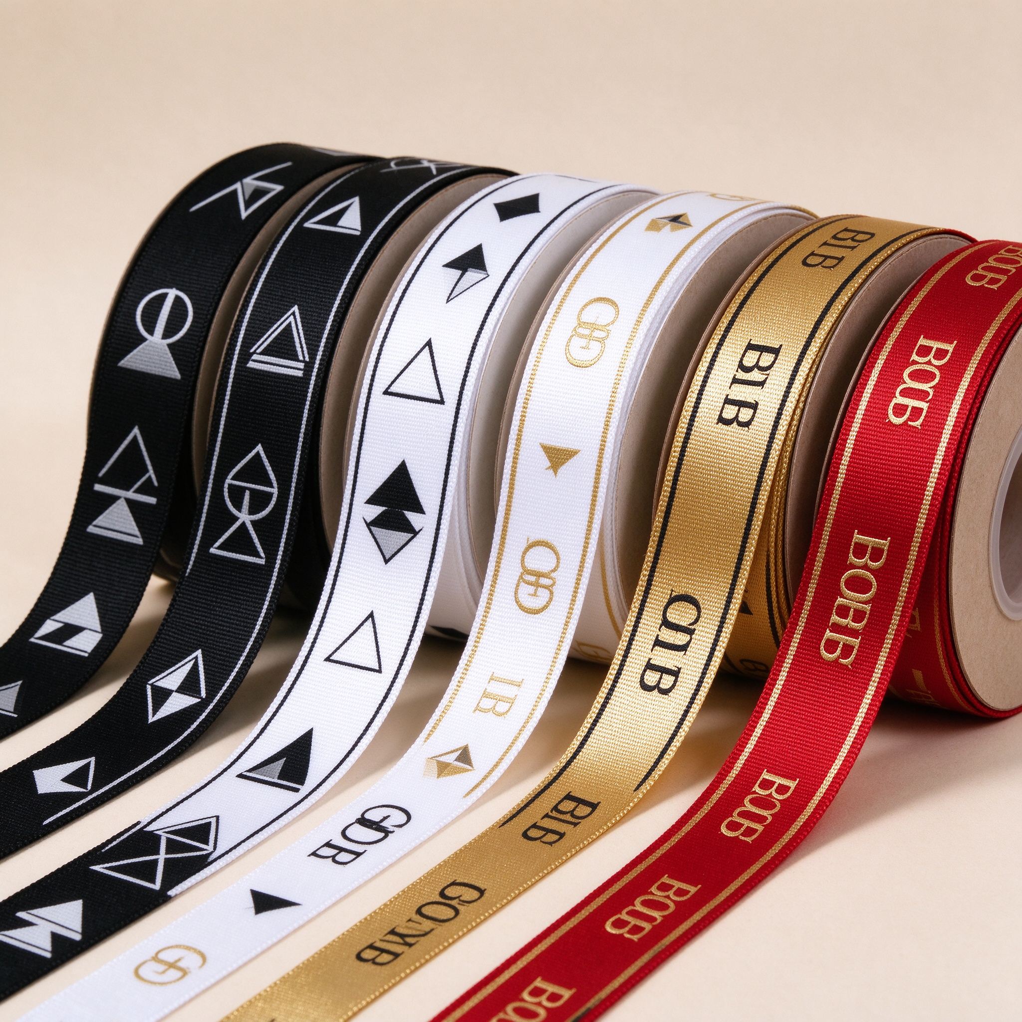 Custom printed ribbon rolls with brand logos from AuraRibbon